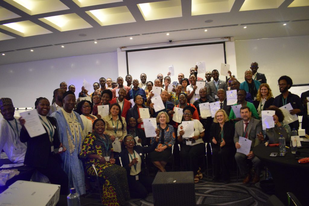 Picture of a group of participants posing for a picture with their certificates during IFLA Regional Workshop, Nairobi, Kenya