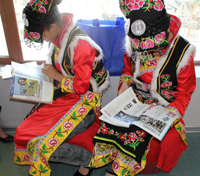 Two Qiang Girls Reading in the Library; Qiang Autonomous Prefecture of Beichuan County Library